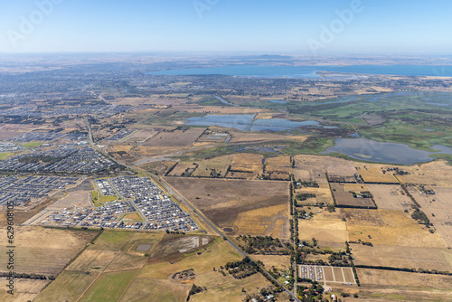 Aerial view of Lake Connewarre Nature reserve with small settlements of residential houses, Victoria, Australia. photo