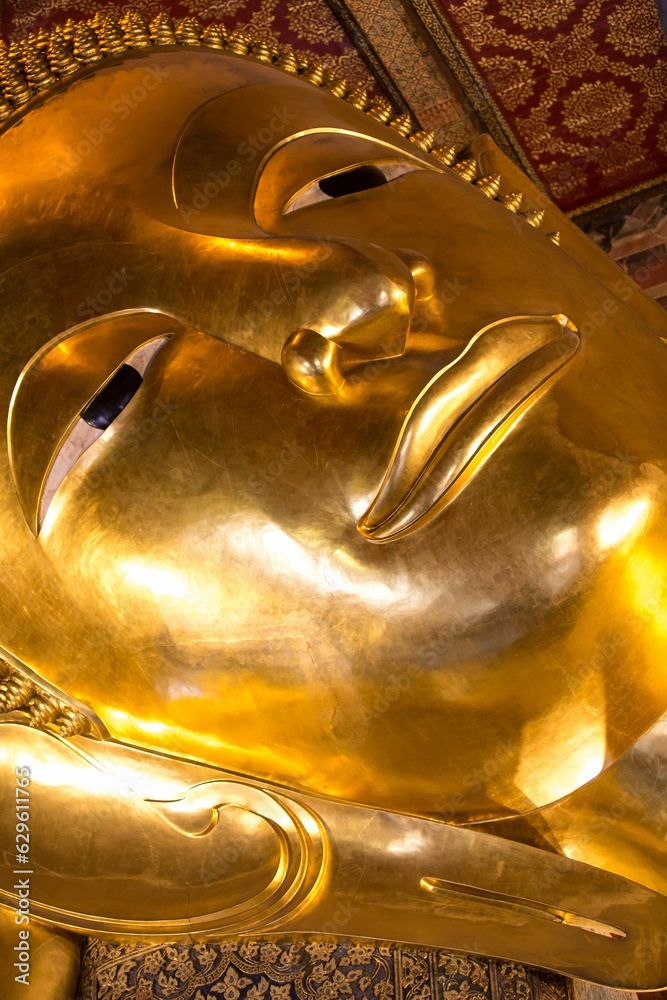 Golden Buddha statue at Wat Pho, Bangkok, Thailand.