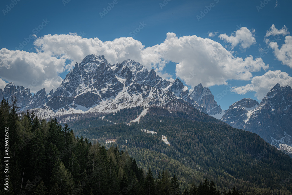 landscape of beautiful mountains in the alps cloudy day with blue sky