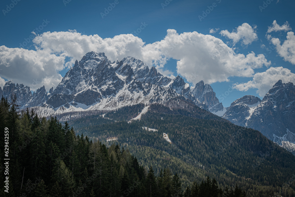landscape of beautiful mountains in the alps cloudy day with blue sky