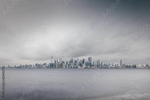 Photography Beautiful shot of the cityscape of Toronto, Ontario, Canada on a gloomy stormy d