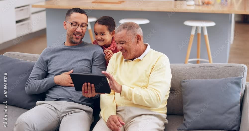 Tablet, boo or a girl scaring her father and grandpa on a sofa in the home living room during a family visit. Technology, kids or a daughter running to give her parent and grandparent a fright Tablet, boo or a girl scaring her father and grandpa on a sofa in the home living room during a family visit. Technology, kids or a daughter running to give her parent and grandparent a fright
