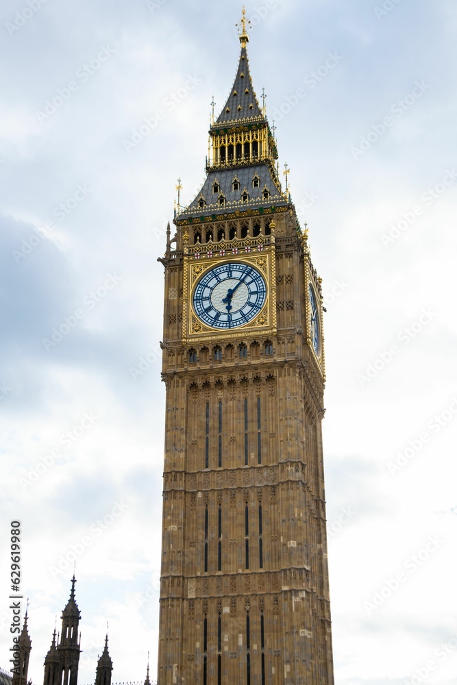 Iconic clock tower stands majestic in the foreground of a picturesque landscape in London, England