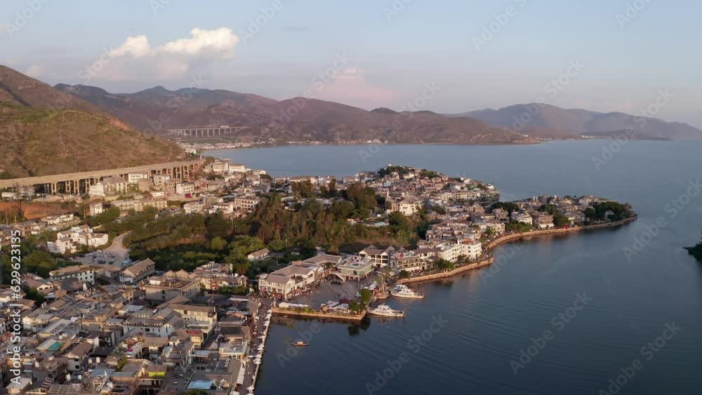 Village and lake in Shuanglang, Yunnan, China.