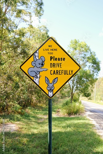 Fototapeta Naklejka Na Ścianę i Meble -  A sign with koalas, alerting drivers to take extra care when driving due to the presence of koalas