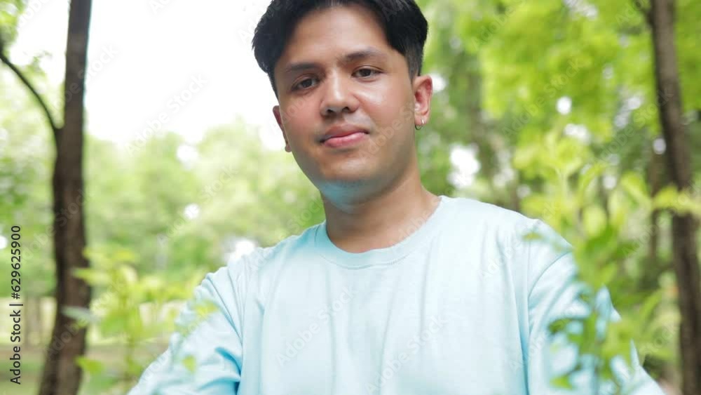Young Asian male volunteers who support nature and the environment hold saplings to plant a forest. Social volunteer concept. world environment day Young Asian male volunteers who support nature and the environment hold saplings to plant a forest. Social volunteer concept. world environment day