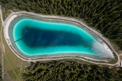 vertical aerial view of Trentino Montagnoli lake photo