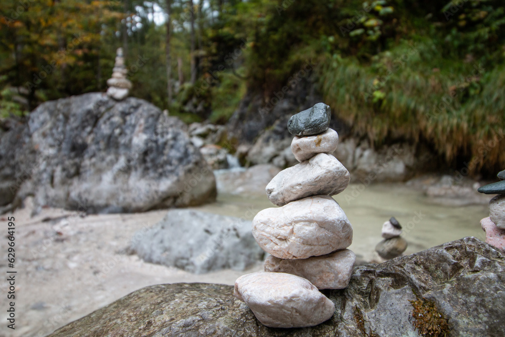 stone tower on a torrent flowing through a wooded area stone tower on a torrent flowing through a wooded area