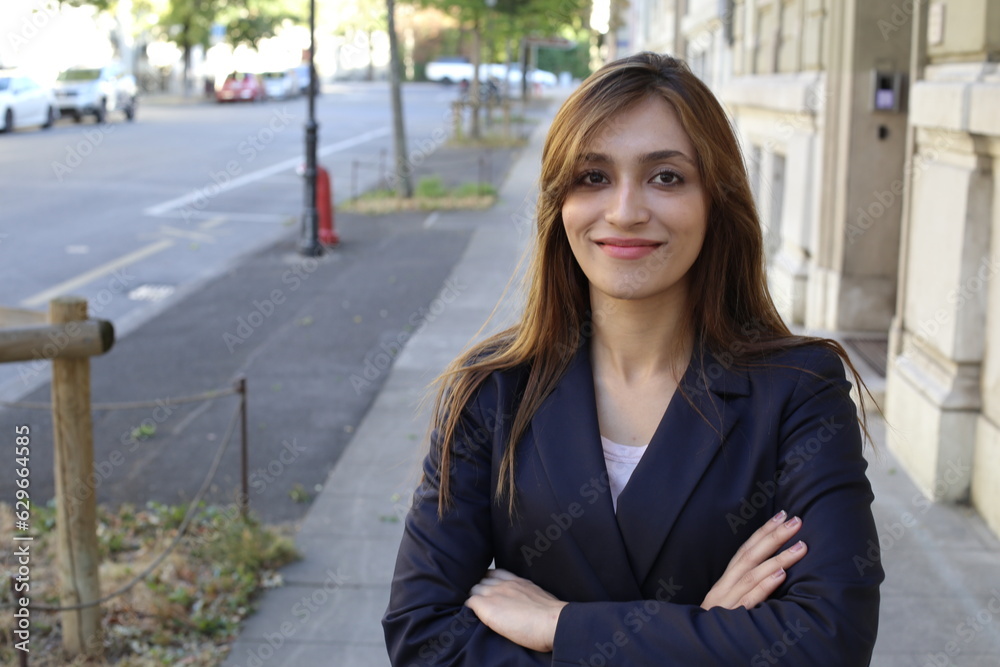 Exotic businesswoman posing in urban background Exotic businesswoman posing in urban background