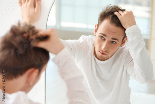 Young man with hair loss pr...