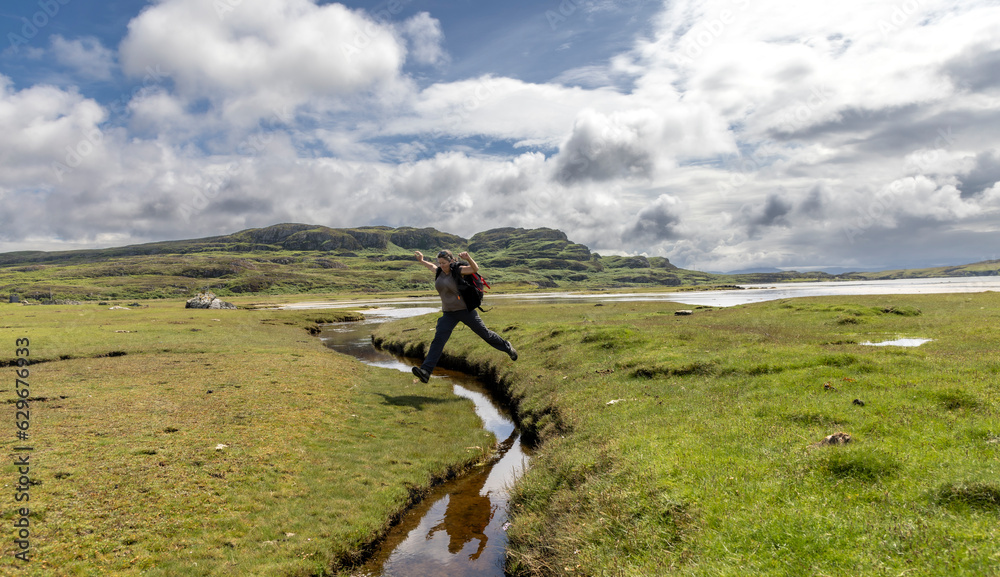 woman hiking on the isle of Colonsay, Scotland