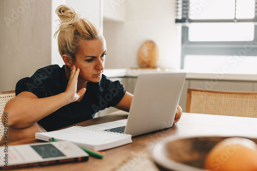 Mature adult woman working at home