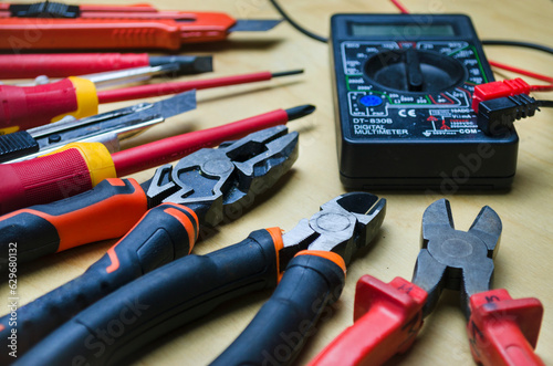 Different types of tools screwdrivers, pliers, nippers.