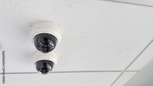 security cameras symbolize surveillance, safety, control, and privacy concerns in modern society