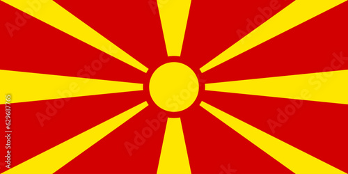 Flag North Macedonia, red cloth with yellow sun image with eight divergent rays