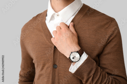 Stylish young man with wris...