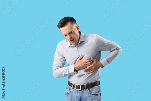 Young man having heart atta...