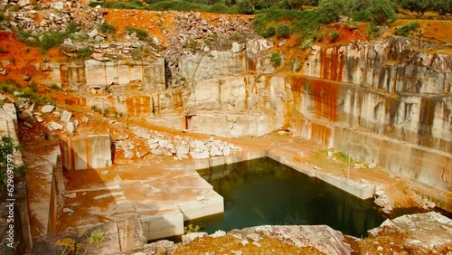 A large marble quarry in Vila Vicosa, Alentejo, Portugal, unveils the dazzling white stone bathed in the warm glow of the setting sun photo