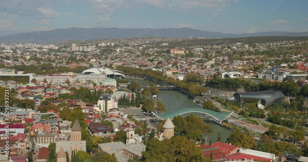 Tbilisi, Georgia. Panoramic View On Cityscape Famous Landmarks. Air Balloon Viewpoint, Sameba Holy Trinity Church, Bridge Of Peace, Concert Music Theatre Exhibition Hall, Presidential Palace. Tbilisi, Georgia. Panoramic View On Cityscape Famous Landmarks. Air Balloon Viewpoint, Sameba Holy Trinity Church, Bridge Of Peace, Concert Music Theatre Exhibition Hall, Presidential Palace.
