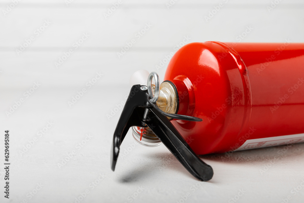 Fire Extinguisher On A White Texture Background. Fire Protection, Home 