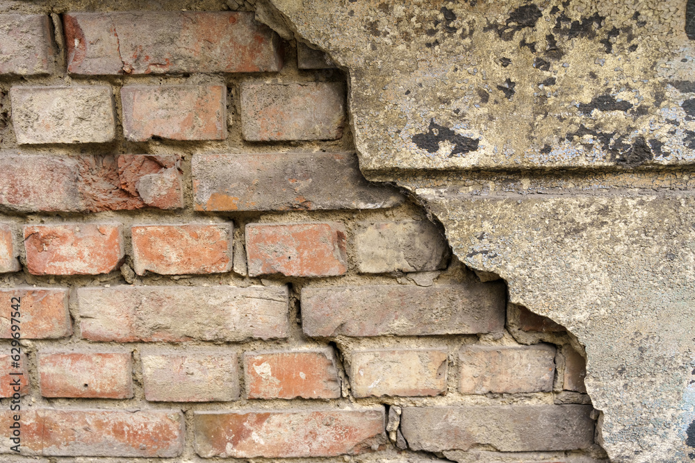 Fototapeta premium Old brick wall with destroyed plaster. Texture