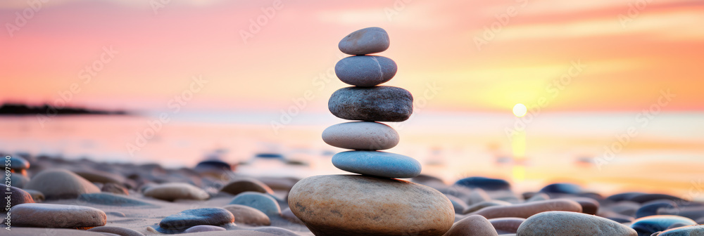 Obraz premium Zen stone tower with peaceful sea and sky bokeh