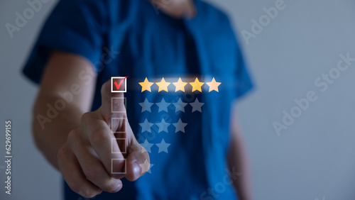 Customer service best business rating. Development and create satisfaction for customers in the future. Businessman using a finger point touch chooses the best satisfaction 5 stars.