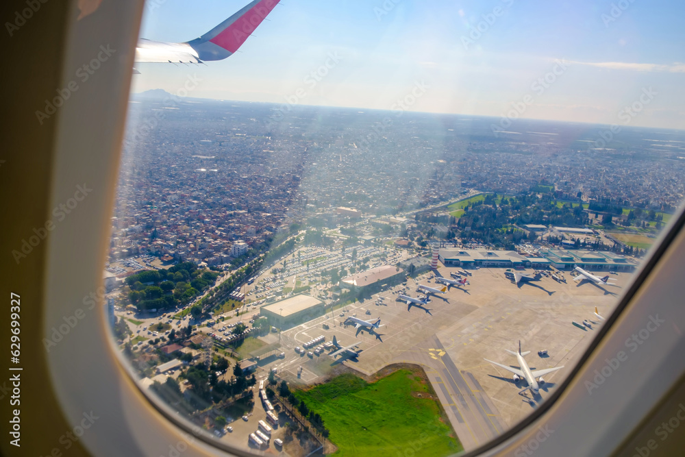 Looking through window aircraft during flight over Adana in sunny weather Looking through window aircraft during flight over Adana in sunny weather