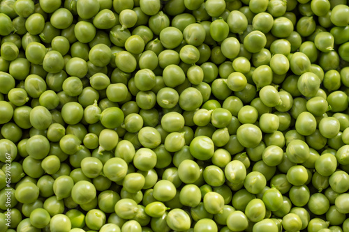 Green Peas. Green background. Peas background. Top view.