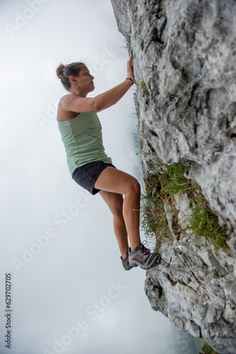 Girl climbing the mountain