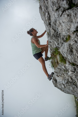 Girl climbing the mountain