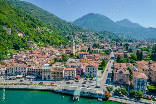 Porlezza town, Lugano Lake. Aerial panoramic photo of town in Lugano Lake between Switzerland and Lombardy, Italy photo