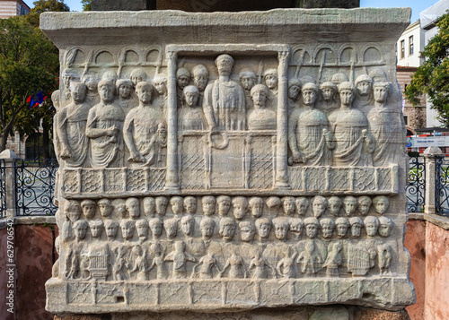 Theodosius I offers laurels of victory at the hippodrome of Constantinople. Marble relief of eastern face of pedestal of the Obelisk of Theodosius (series). Sultan Ahmet square, Istanbul, Turkey photo