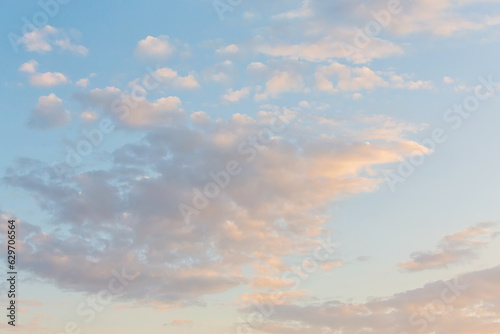 Panoramic view of clear blue sky and clouds, Blue sky background with tiny clouds. White and pearl fluffy clouds in the blue sky at sunrise. Atmosphere background or wallpaper