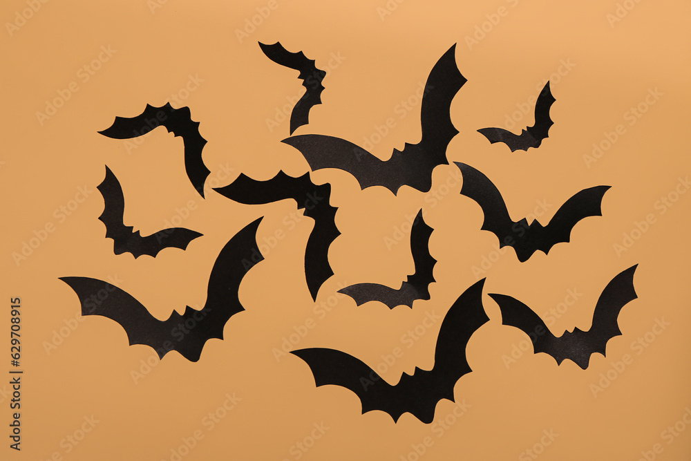 Paper bats for Halloween party on beige background Paper bats for Halloween party on beige background