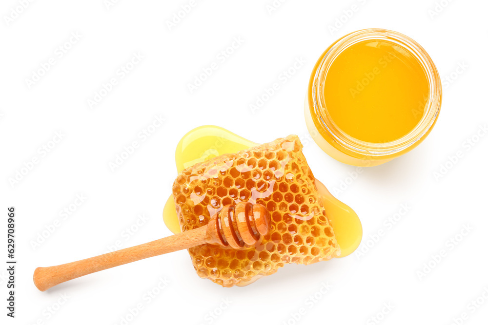 Bowl of sweet honey, dipper and comb on white background Bowl of sweet honey, dipper and comb on white background