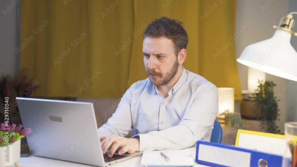 Home office worker man working seriously and focused. Home office worker man working seriously and focused.
