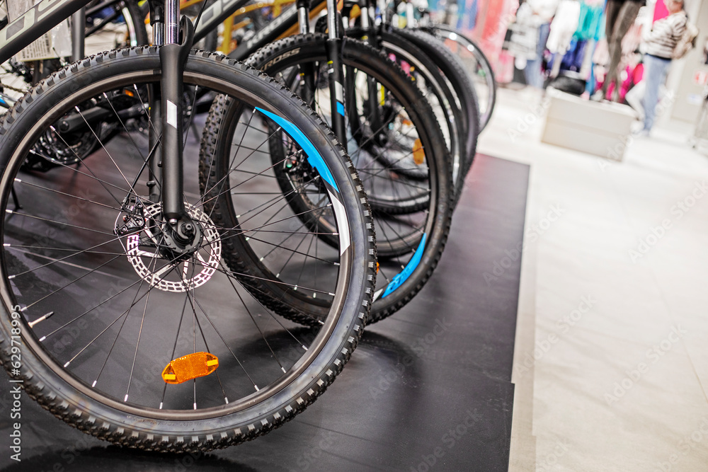 sports universal bikes in a sports shop lined up in a row sports universal bikes in a sports shop lined up in a row