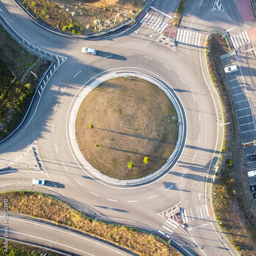 Car traffic on a roundabout at sunset. Portugal, 2023  © Pedro Lopes