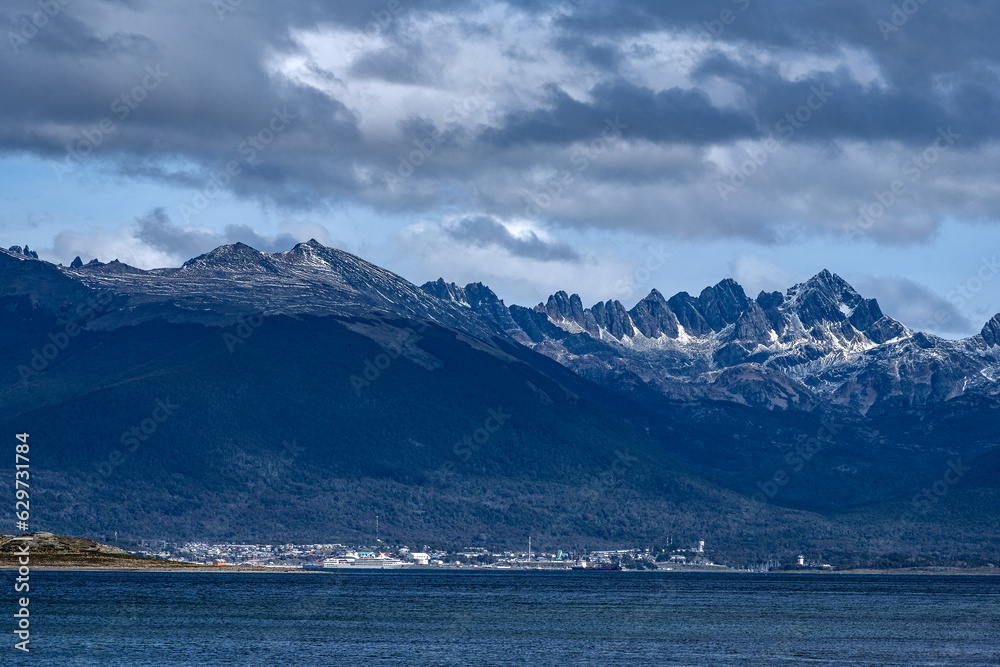 Puerto Williams in Chile, Tierra del Fuego, Patagonia, seen from the Beagle Channel with the Andes Mountains behind.