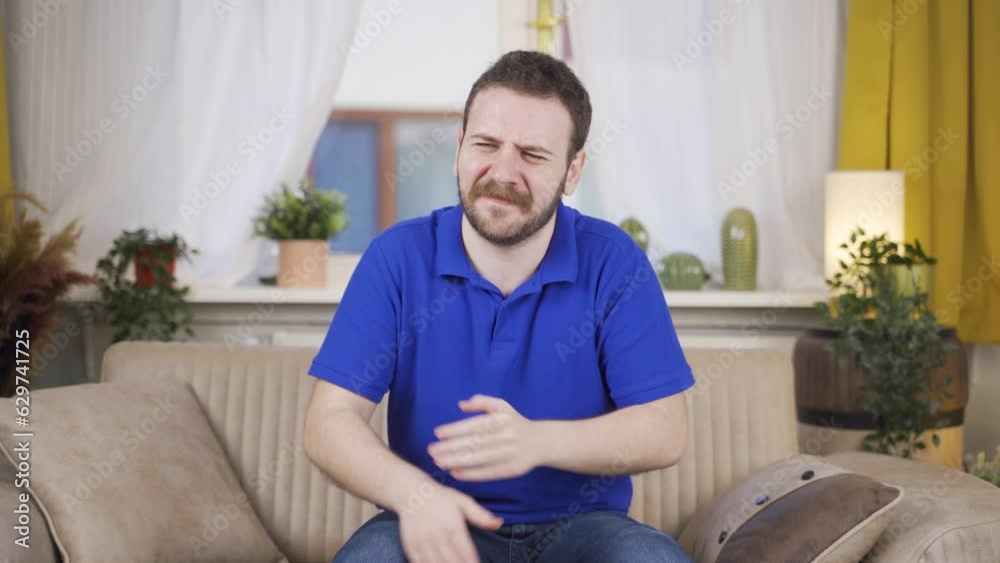 The man is suffering from joint pain. The man is suffering from joint pain.