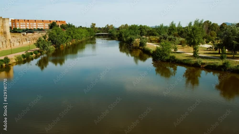 Panoramic view of Guadiana River, Merida, Spain, flows gently by the Alcazaba, creating a picture of serene beauty and timeless history Panoramic view of Guadiana River, Merida, Spain, flows gently by the Alcazaba, creating a picture of serene beauty and timeless history