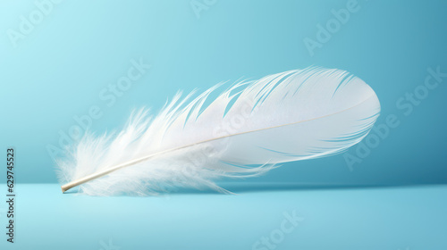 Simple and clean composition of a single white feathers floating against a soft gradient background