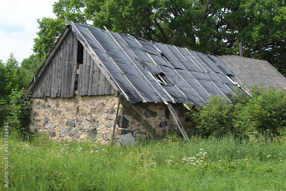 Abandoned barn with stone walls in Sece, Latvia Abandoned barn with stone walls in Sece, Latvia