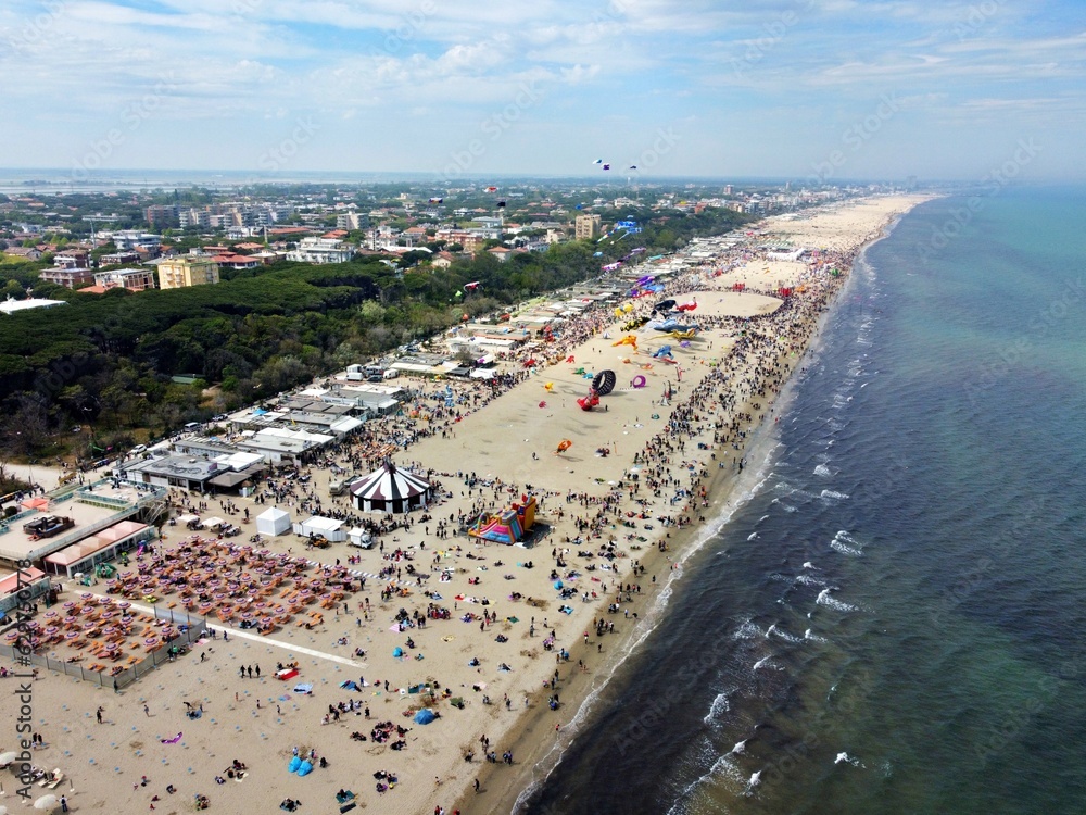 Aerial view of a gathering of kites on the beach at Pinarella di Cervia, Ravenna, Italy