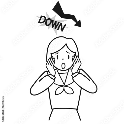 成績が下がってショックを受ける女子高生