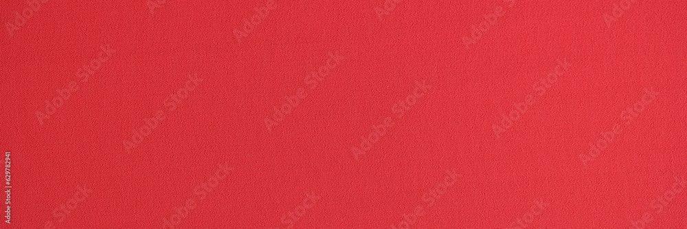 Fototapeta premium Unicolorous bright red textile as background.