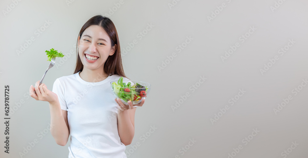 Happy woman eating salad vegetables. Female and healthy food diet. Want to lose weight. Eat healthy diet. Choose vegetable salad menu. Food full of benefits. Copy space. Happy woman eating salad vegetables. Female and healthy food diet. Want to lose weight. Eat healthy diet. Choose vegetable salad menu. Food full of benefits. Copy space.