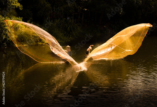 Fishing with nets on Nhu Y river, Hue city, Vietnam photo