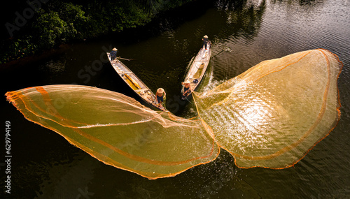 Fishing with nets on Nhu Y river, Hue city, Vietnam photo